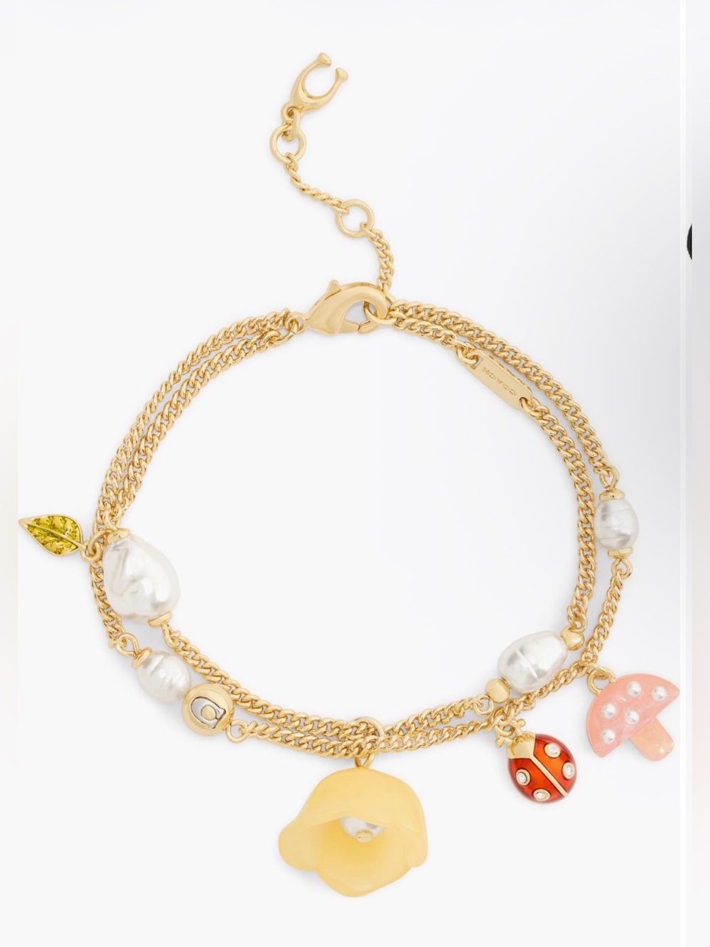 COACH
Floral Charm Double
Strand . New with tag